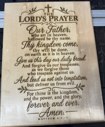 The Lord's Prayer engraved on a maple plaque