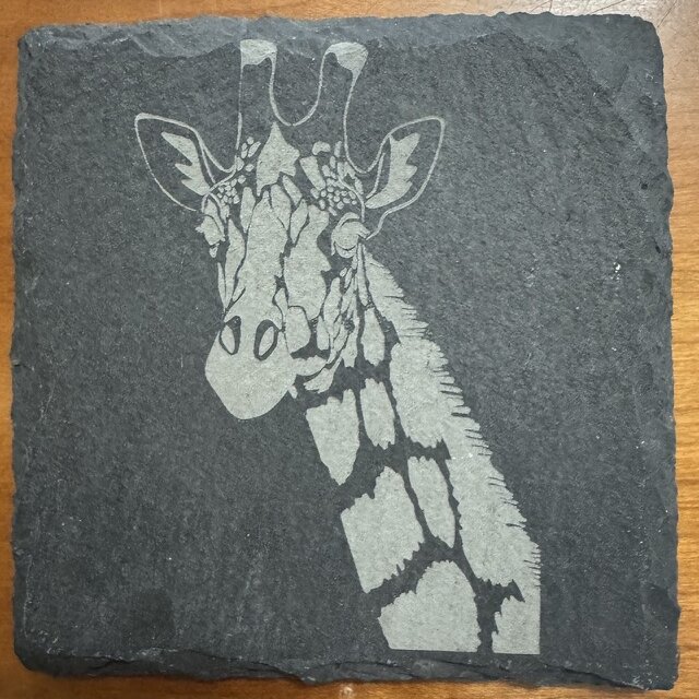Giraffe engraved on a natural slate coaster
